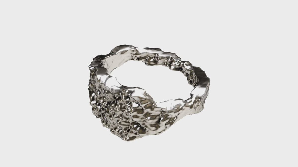 Distorted I rotating: a solid 925 silver band with an eroded, pitted surface